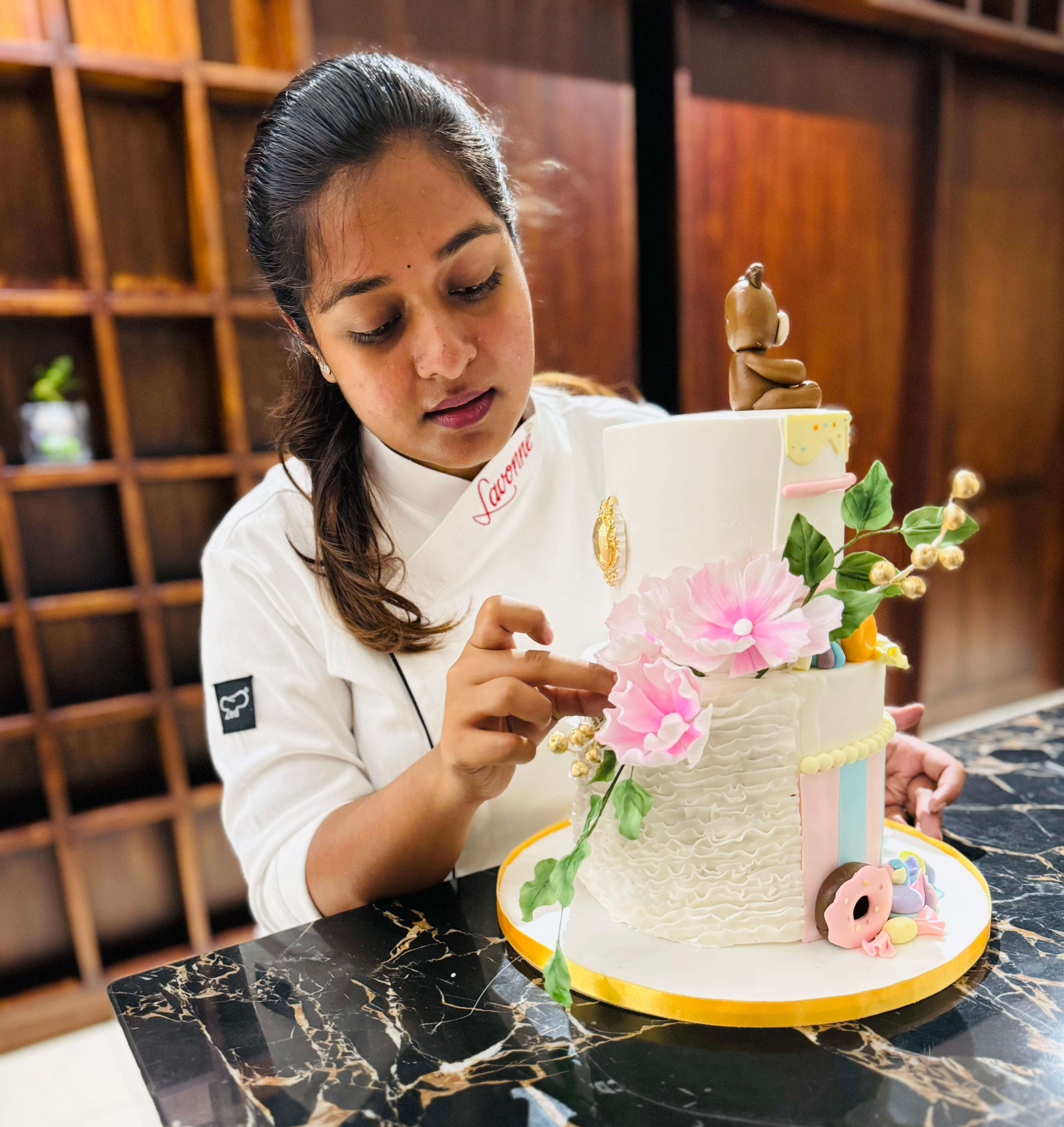 Vidya Sri decorating a celebration cake